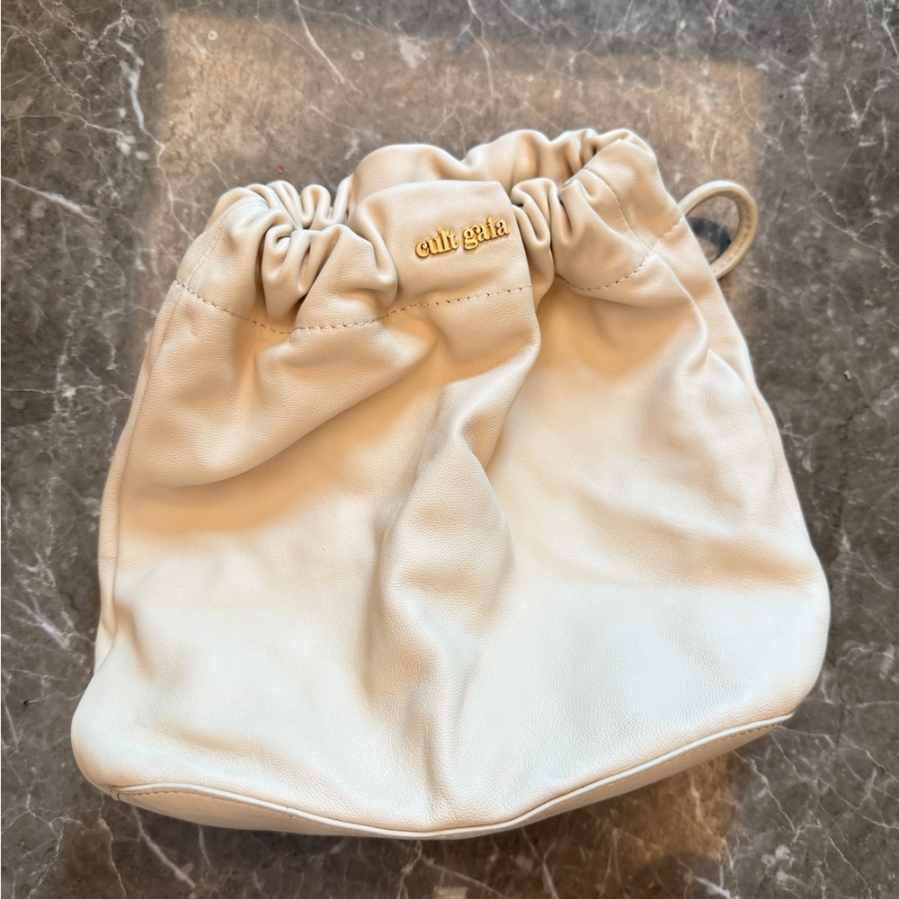 cult gaia Cream Ruched Drawstring Leather Bucket Bag with Gold Logo